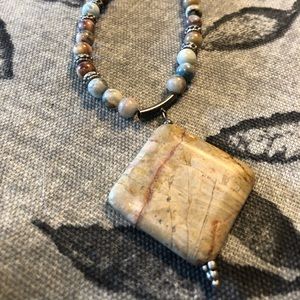 Stone pendant necklace.